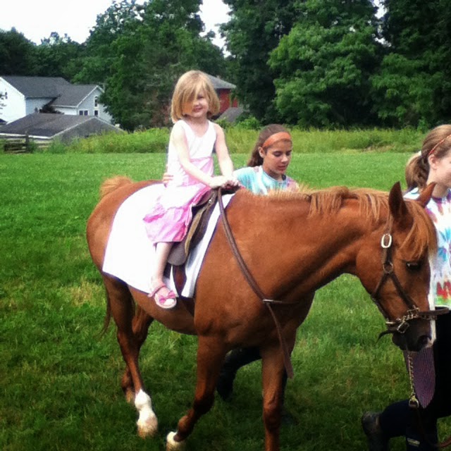 A young Lily Ann on horseback — the very beginning