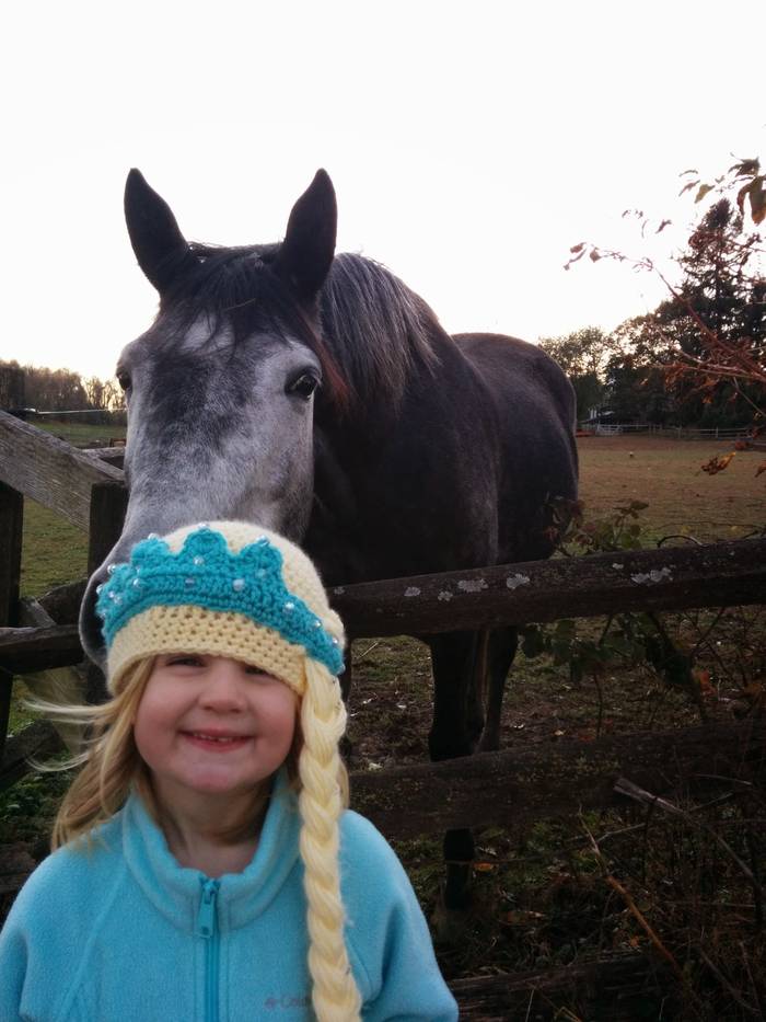 Little Lily in princess crown at the farm