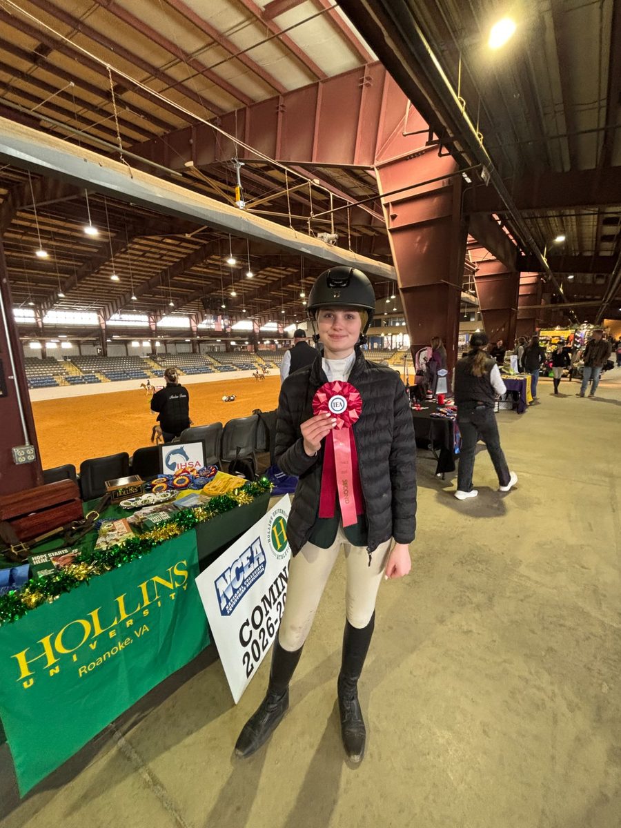 Lily with her Day 1 ribbon and National Qualifier certificate