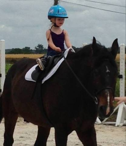 Little Lily in the saddle for the first time